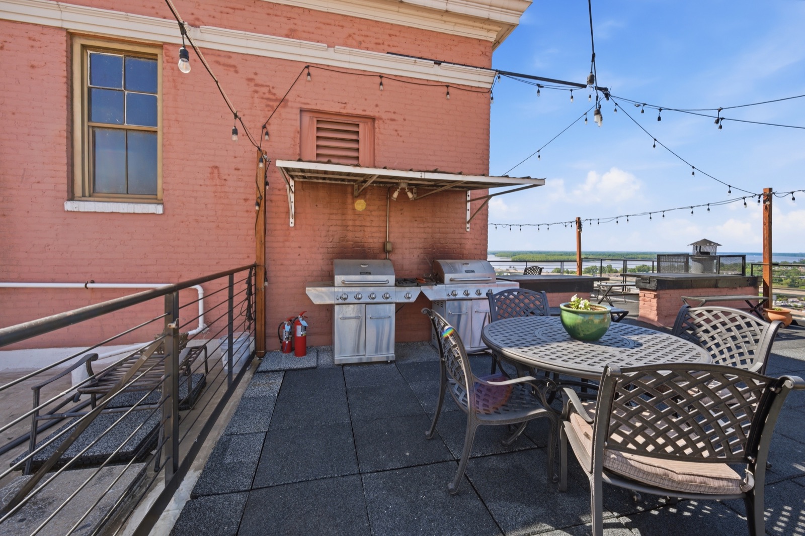 Rooftop grills along the brick wall